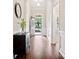 Hallway with beautiful wood floors, white wainscoting, and an open view to the front door at 3068 Streamhaven Dr, Lancaster, SC 29707