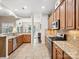 Well-equipped kitchen with stainless steel appliances, granite countertops, and tile floors at 3068 Streamhaven Dr, Lancaster, SC 29707