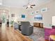 Inviting living room with hardwood floors, large windows, and a ceiling fan at 3068 Streamhaven Dr, Lancaster, SC 29707