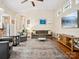 Spacious living room with a large TV, comfortable seating, and hardwood floors at 3068 Streamhaven Dr, Lancaster, SC 29707