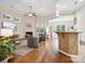 Spacious living room with a fireplace, hardwood floors, and a ceiling fan at 3068 Streamhaven Dr, Lancaster, SC 29707