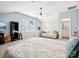 Bright main bedroom featuring a ceiling fan, sitting area, and ensuite bathroom at 3068 Streamhaven Dr, Lancaster, SC 29707