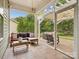 Inviting screened-in patio with comfortable seating and a view of the backyard at 3068 Streamhaven Dr, Lancaster, SC 29707