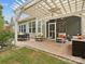 Charming outdoor patio with comfortable seating, a dining table, and a pergola at 3068 Streamhaven Dr, Lancaster, SC 29707