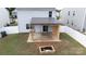 Spacious backyard with a covered patio, wooden posts, fire pit and privacy fence at 316 Gaines Rd, Clover, SC 29710