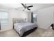 This light and airy bedroom features a ceiling fan, plush carpet and large double bed at 316 Gaines Rd, Clover, SC 29710