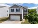 Charming two-story home with brick accents, a garage, and mature landscaping at 316 Gaines Rd, Clover, SC 29710