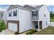 Beautiful two-story home featuring white siding, blue shutters, brick accents, and an attached garage at 316 Gaines Rd, Clover, SC 29710
