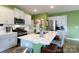 Bright kitchen features stainless steel appliances, white countertops, and a large center island at 316 Gaines Rd, Clover, SC 29710