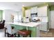 Bright kitchen features an island with seating, stainless steel appliances, and white cabinets at 316 Gaines Rd, Clover, SC 29710