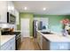 Open concept kitchen with stainless steel appliances, a large island, and wood flooring at 316 Gaines Rd, Clover, SC 29710