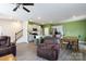Open-concept living area with kitchen island, dining table, and leather furniture at 316 Gaines Rd, Clover, SC 29710