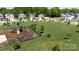 Elevated view of a community playground surrounded by a spacious green area and well-kept homes at 316 Gaines Rd, Clover, SC 29710