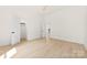 Bedroom with hardwood flooring, closet and entrance, and neutral-colored walls at 317 S Pink St, Cherryville, NC 28021
