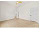 This bedroom features light-colored floors, neutral paint, and a ceiling fan at 317 S Pink St, Cherryville, NC 28021
