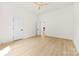 A spacious bedroom featuring a ceiling fan, neutral walls, and wood-look flooring at 317 S Pink St, Cherryville, NC 28021