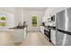 Contemporary kitchen with white cabinets, and stainless-steel appliances at 317 S Pink St, Cherryville, NC 28021