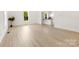 Sunlit living area with light wood floors connecting to an open-concept kitchen at 317 S Pink St, Cherryville, NC 28021