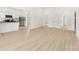 Large, open-concept living area with wood-look flooring and bright, white walls at 317 S Pink St, Cherryville, NC 28021