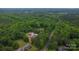Aerial view of the property surrounded by mature trees and landscaping at 332 E Rebound Rd, Lancaster, SC 29720