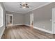 Bedroom featuring light wood floors, light gray walls, white trim, and multiple doorways at 332 E Rebound Rd, Lancaster, SC 29720