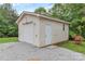 Detached garage with a roll-up door and a separate entrance at 332 E Rebound Rd, Lancaster, SC 29720