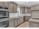 Beautiful updated kitchen with stainless steel appliances, granite countertops, and stylish cabinetry at 332 E Rebound Rd, Lancaster, SC 29720