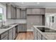 Modern kitchen featuring granite countertops, stainless steel appliances and bright lighting at 332 E Rebound Rd, Lancaster, SC 29720