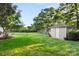 Large backyard featuring a shed, swingset, and lush lawn, perfect for outdoor activities and relaxation at 3340 Blue Jay Pass, Fort Mill, SC 29708