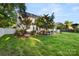 Green backyard showcasing well-maintained lawn, and white fence that create a serene outdoor space at 3340 Blue Jay Pass, Fort Mill, SC 29708