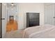 Bright bedroom showcasing a black dresser and view into the hallway, creating an inviting atmosphere at 3340 Blue Jay Pass, Fort Mill, SC 29708