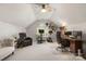 Spacious bonus room with vaulted ceilings, home office space, and exercise area, perfect for various activities at 3340 Blue Jay Pass, Fort Mill, SC 29708