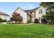 Beautiful two-story home with a well-manicured lawn and stone accents at 3340 Blue Jay Pass, Fort Mill, SC 29708
