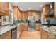 Well-equipped kitchen boasting granite countertops, stainless steel appliances, and wooden cabinets at 3340 Blue Jay Pass, Fort Mill, SC 29708