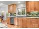 Charming kitchen showcasing granite countertops, stainless steel appliances, and wood cabinets at 3340 Blue Jay Pass, Fort Mill, SC 29708
