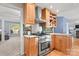 Modern kitchen with stainless steel appliances, granite countertops, and open access to living area at 3340 Blue Jay Pass, Fort Mill, SC 29708