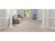 Spacious living room with large windows, neutral carpet, and columns at 3340 Blue Jay Pass, Fort Mill, SC 29708