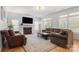 Bright living room with fireplace, TV, and plush seating at 3340 Blue Jay Pass, Fort Mill, SC 29708