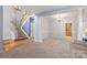 Open-concept living room with stairs and view of the kitchen at 3340 Blue Jay Pass, Fort Mill, SC 29708