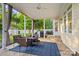 Charming patio area featuring a fire pit, comfortable seating, and a view of the backyard at 3340 Blue Jay Pass, Fort Mill, SC 29708