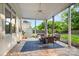 Relaxing covered patio area with stylish outdoor furniture, a ceiling fan, and views of the backyard at 3340 Blue Jay Pass, Fort Mill, SC 29708
