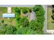 Aerial view of the property surrounded by mature shade trees and outlined with a green line, bordering the property at 3418 Sulphur Springs Ne Rd, Hickory, NC 28601