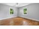 Empty bedroom with hardwood floors, natural light, and neutral wall colors at 3418 Sulphur Springs Ne Rd, Hickory, NC 28601