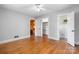 Spacious bedroom with hardwood floors and an open doorway to connecting rooms at 3418 Sulphur Springs Ne Rd, Hickory, NC 28601