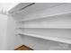 Organized closet featuring white shelving and hardwood floors at 3418 Sulphur Springs Ne Rd, Hickory, NC 28601