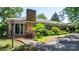 Beautiful ranch-style home with stone facade, brick chimney, and manicured landscaping, perfect curb appeal at 3418 Sulphur Springs Ne Rd, Hickory, NC 28601