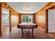 Game room featuring a billiard table, wood paneled walls, and lots of natural light at 3418 Sulphur Springs Ne Rd, Hickory, NC 28601