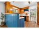 Kitchen features wood cabinets, blue accents, stainless steel appliances, and a connecting space at 3418 Sulphur Springs Ne Rd, Hickory, NC 28601