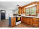 Bright kitchen featuring custom wood cabinets, white countertops, stainless steel appliances, and a window for natural light at 3418 Sulphur Springs Ne Rd, Hickory, NC 28601