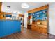 Retro kitchen with blue and wood cabinetry, laundry area, and open layout design at 3418 Sulphur Springs Ne Rd, Hickory, NC 28601